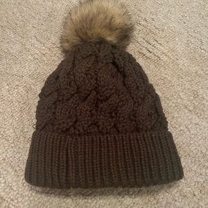 CC green stocking hat w brown fur pom pom